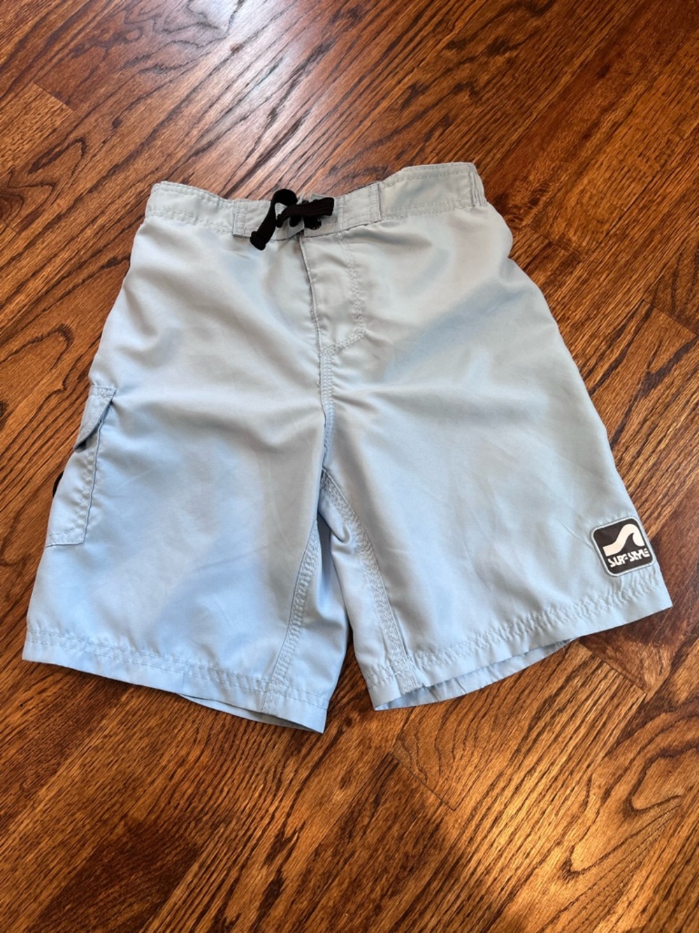 surf style light blue kid’s swim trunks